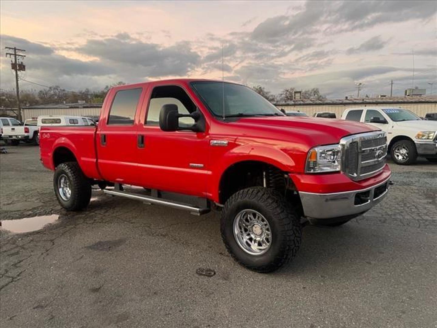 2005 Red Clearcoat Ford F-250 Super Duty Lariat (1FTSW21P05E) with an 6.0L Power Stroke 6.0L Diesel Turbo V8 325hp 560ft. lbs. Direct Injection engine, 5-Speed Automatic transmission, located at 800 Riverside Ave, Roseville, CA, 95678, (916) 773-4549, 38.732265, -121.291039 - DIESEL CREW CAB 4X4 BULLET PROOF EGR COOLER HEADSTUDS NEW TIRES LIFTED - Photo#1