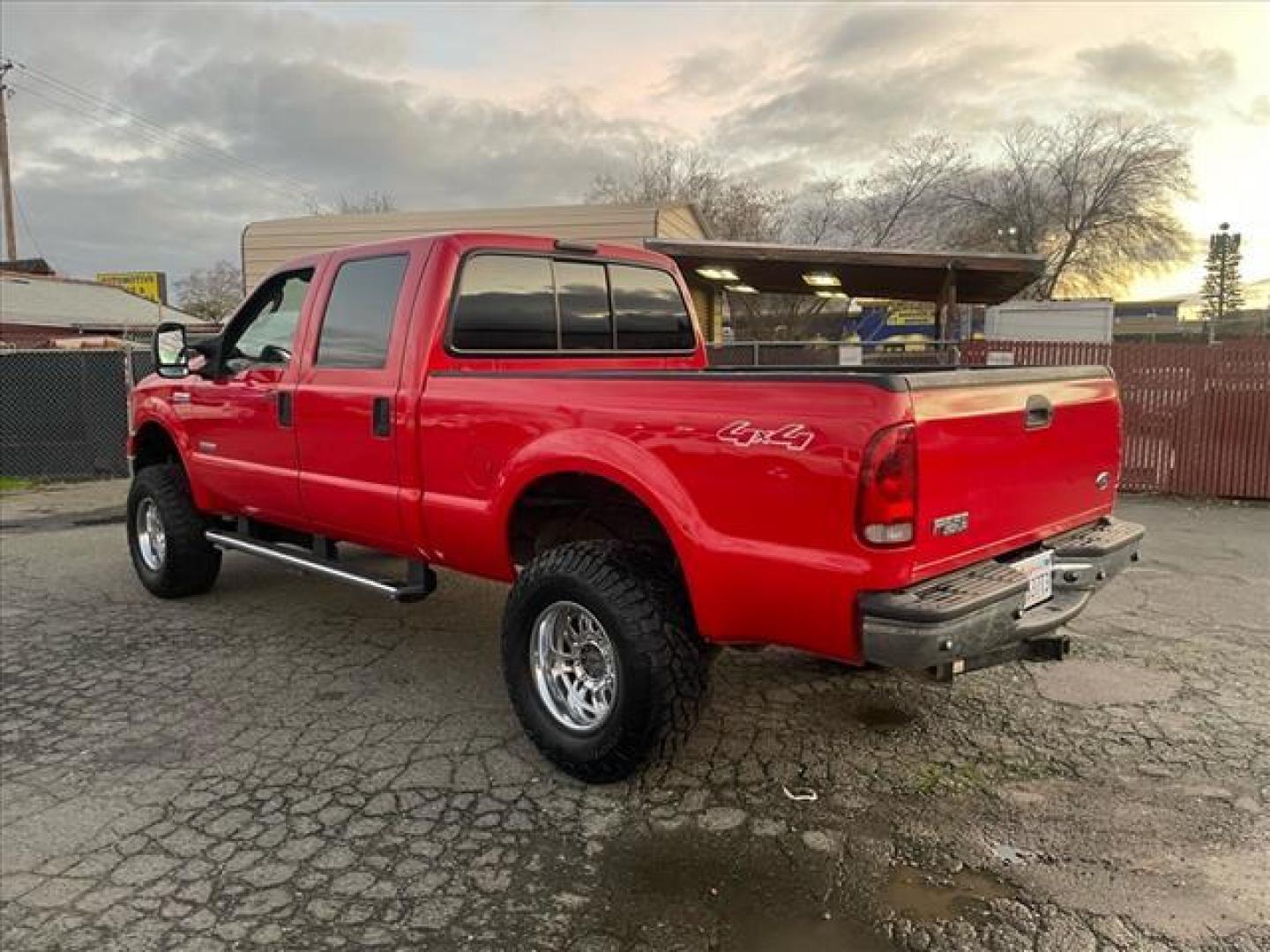 2005 Red Clearcoat Ford F-250 Super Duty Lariat (1FTSW21P05E) with an 6.0L Power Stroke 6.0L Diesel Turbo V8 325hp 560ft. lbs. Direct Injection engine, 5-Speed Automatic transmission, located at 800 Riverside Ave, Roseville, CA, 95678, (916) 773-4549, 38.732265, -121.291039 - DIESEL CREW CAB 4X4 BULLET PROOF EGR COOLER HEADSTUDS NEW TIRES LIFTED - Photo#2