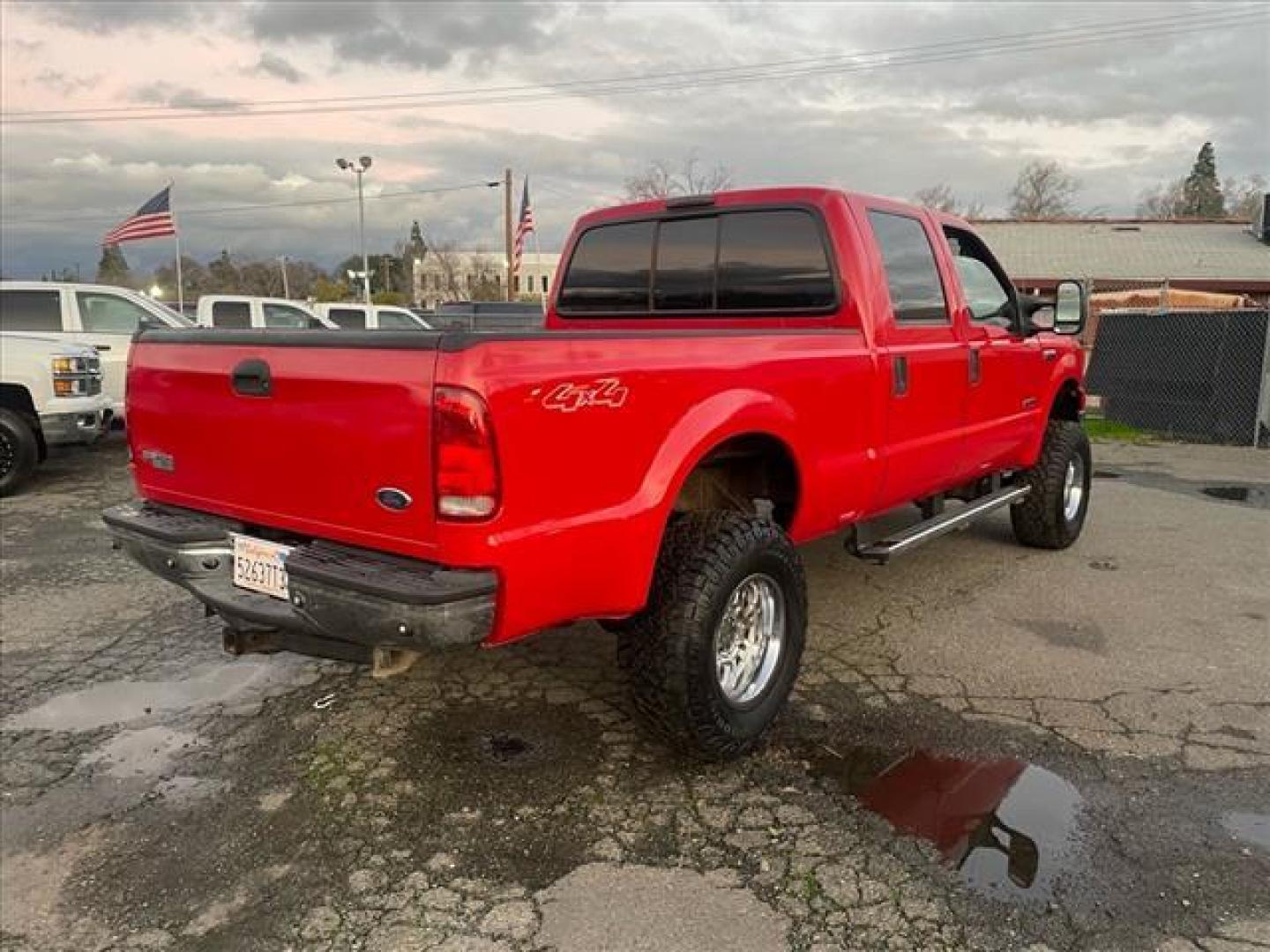 2005 Red Clearcoat Ford F-250 Super Duty Lariat (1FTSW21P05E) with an 6.0L Power Stroke 6.0L Diesel Turbo V8 325hp 560ft. lbs. Direct Injection engine, 5-Speed Automatic transmission, located at 800 Riverside Ave, Roseville, CA, 95678, (916) 773-4549, 38.732265, -121.291039 - DIESEL CREW CAB 4X4 BULLET PROOF EGR COOLER HEADSTUDS NEW TIRES LIFTED - Photo#3