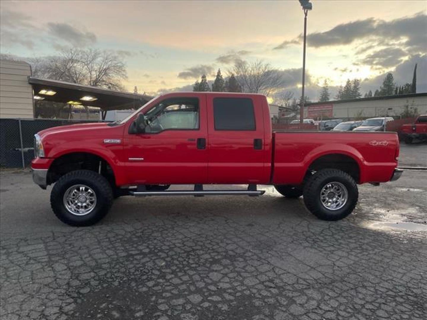 2005 Red Clearcoat Ford F-250 Super Duty Lariat (1FTSW21P05E) with an 6.0L Power Stroke 6.0L Diesel Turbo V8 325hp 560ft. lbs. Direct Injection engine, 5-Speed Automatic transmission, located at 800 Riverside Ave, Roseville, CA, 95678, (916) 773-4549, 38.732265, -121.291039 - DIESEL CREW CAB 4X4 BULLET PROOF EGR COOLER HEADSTUDS NEW TIRES LIFTED - Photo#4