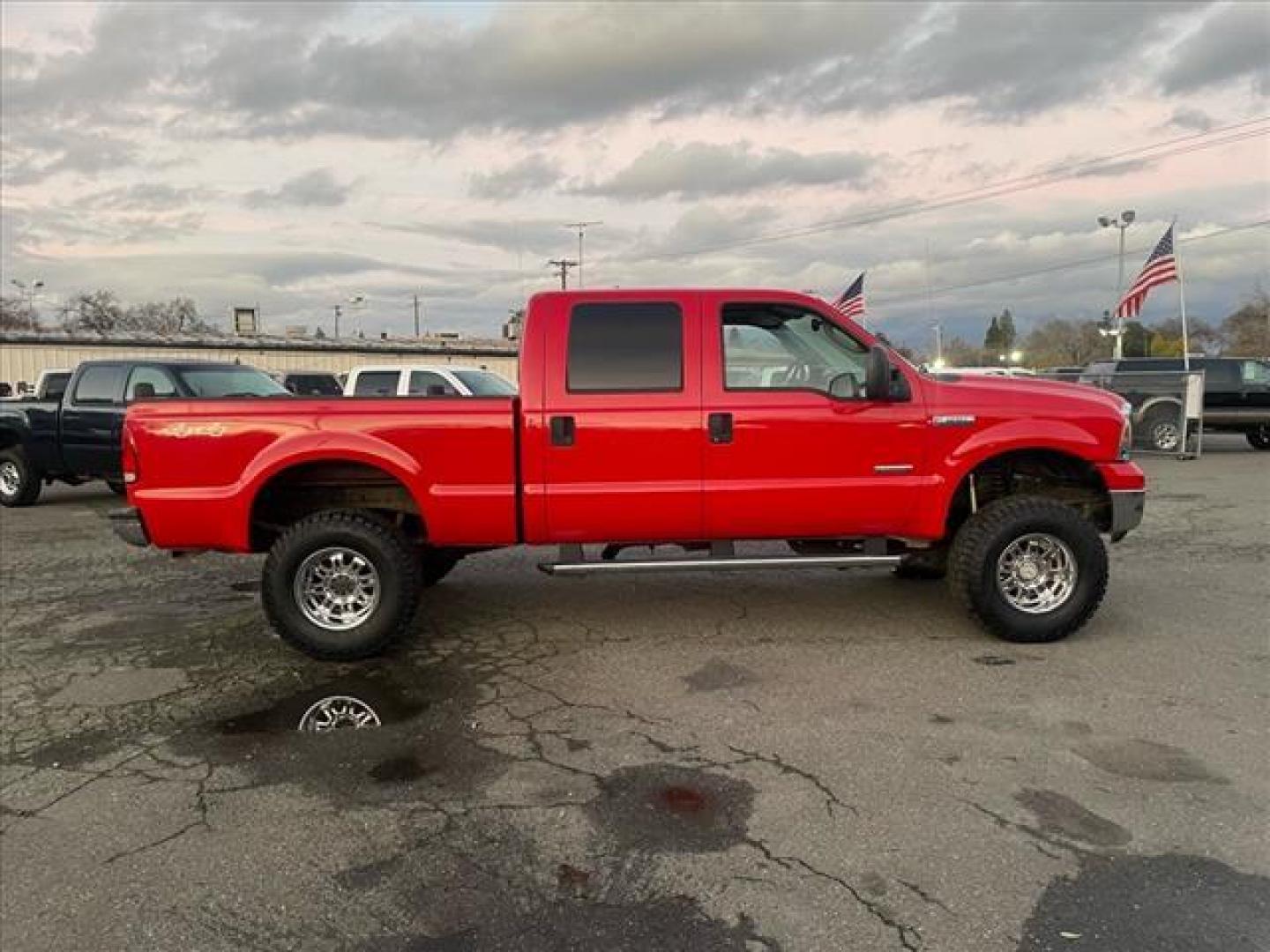 2005 Red Clearcoat Ford F-250 Super Duty Lariat (1FTSW21P05E) with an 6.0L Power Stroke 6.0L Diesel Turbo V8 325hp 560ft. lbs. Direct Injection engine, 5-Speed Automatic transmission, located at 800 Riverside Ave, Roseville, CA, 95678, (916) 773-4549, 38.732265, -121.291039 - DIESEL CREW CAB 4X4 BULLET PROOF EGR COOLER HEADSTUDS NEW TIRES LIFTED - Photo#5