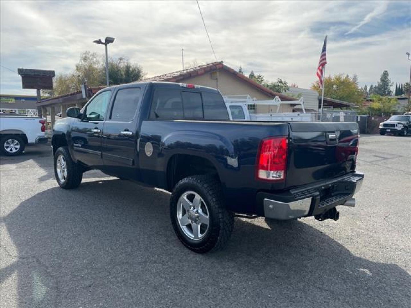 2012 Midnight Blue Metallic GMC Sierra 2500HD SLT (1GT121E87CF) with an 6.6L Duramax 6.6L Diesel Turbo V8 397hp 765ft. lbs. Common Rail Direct Injection engine, Allison 1000 6-Speed Shiftable Automatic transmission, located at 800 Riverside Ave, Roseville, CA, 95678, (916) 773-4549, 38.732265, -121.291039 - Photo#2