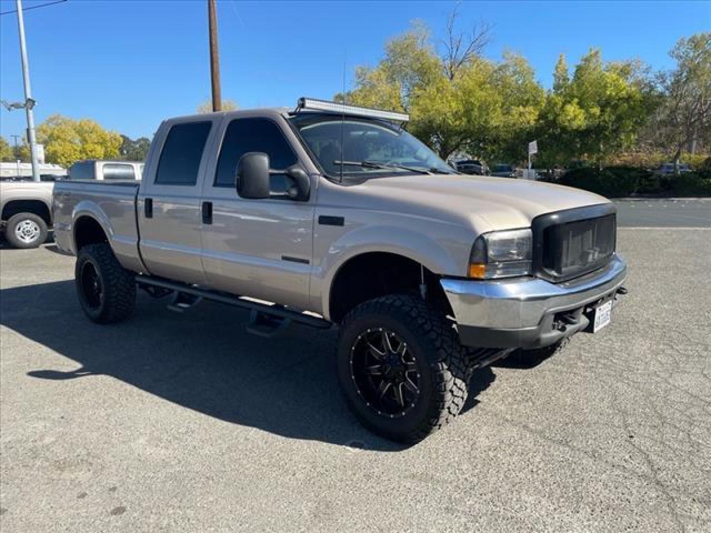 1999 Light Prairie Tan Clearcoat Metallic Ford F-250 Super Duty XLT (1FTNW21F7XE) with an 7.3L Turbocharged Diesel V8 OHV 16V FI Engine Other engine, 4-Speed Automatic transmission, located at 800 Riverside Ave, Roseville, CA, 95678, (916) 773-4549, 38.732265, -121.291039 - Photo#1