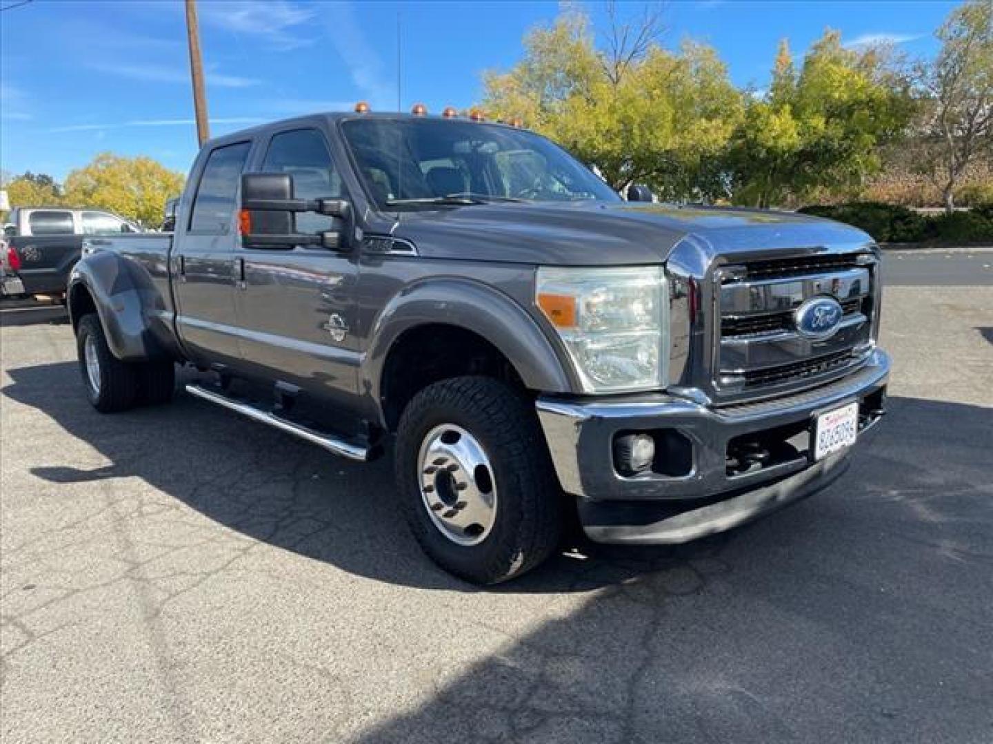 2011 Sterling Grey Metallic Ford F-350 Super Duty Lariat (1FT8W3DT1BE) with an 6.7L Power Stroke 6.7L Biodiesel Turbo V8 400hp 800ft. lbs. Common Rail Direct Injection engine, 6-Speed Shiftable Automatic transmission, located at 800 Riverside Ave, Roseville, CA, 95678, (916) 773-4549, 38.732265, -121.291039 - DIESEL CREW CAB DUALLY 4X4 LARIAT MOON ROOF CLEAN CARFAX - Photo#1