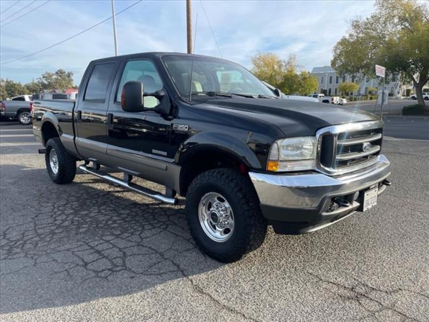 2003 Black/Arizona Beige Metallic Ford F-350 Super Duty Lariat (1FTSW31P13E) with an Power Stroke 6.0L Diesel Turbo V8 325hp 560ft. lbs. Other engine, 5-Speed Automatic transmission, located at 800 Riverside Ave, Roseville, CA, 95678, (916) 773-4549, 38.732265, -121.291039 - DIESEL CREW CAB 4X4 FX4 LARIAT OIL COOLER REPLACED SERVICE RECORDS ON CLEAN CARFAX - Photo#1