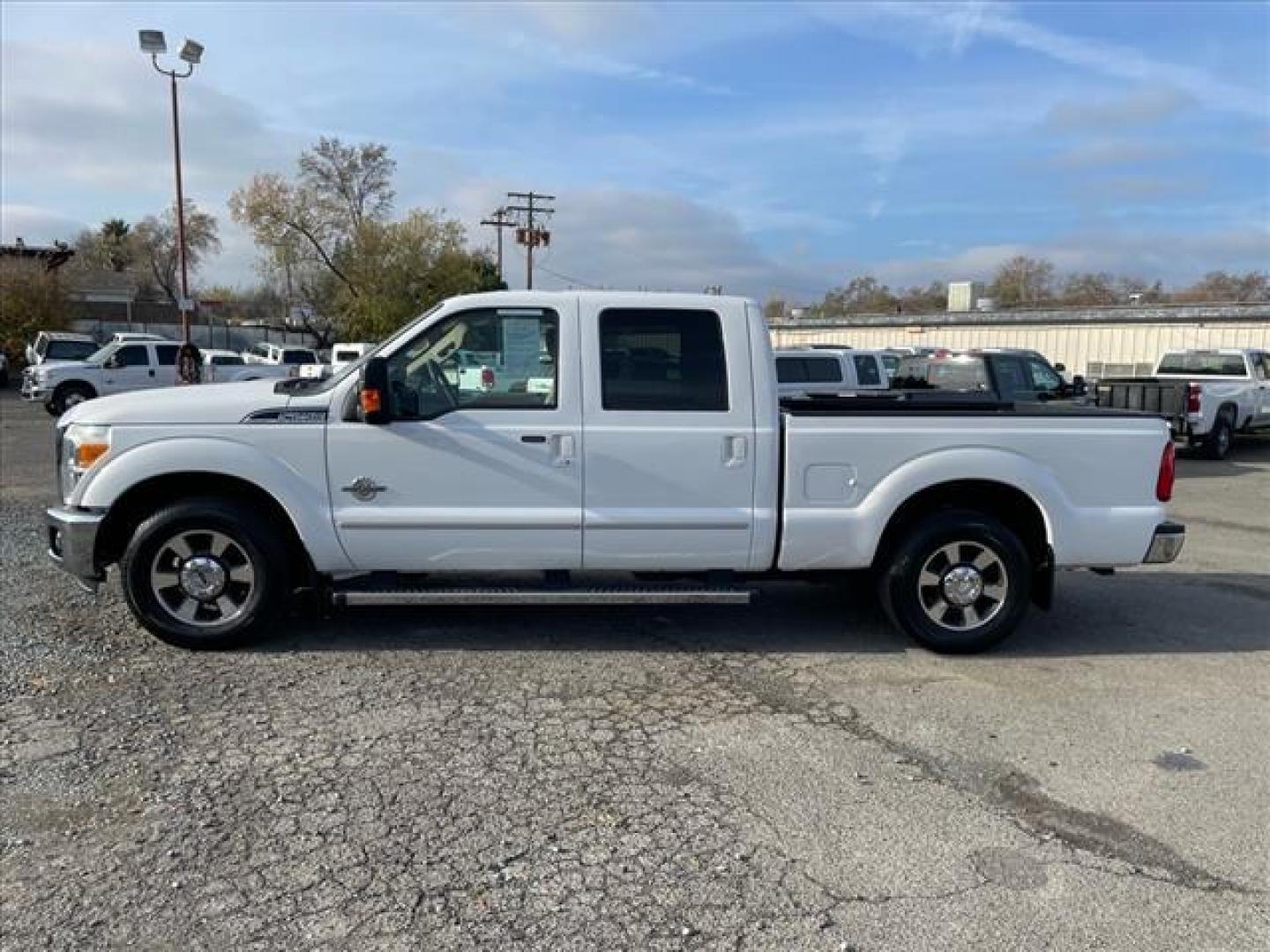 2011 Oxford White Ford F-250 Super Duty Lariat (1FT7W2AT2BE) with an 6.7L Power Stroke 6.7L Biodiesel Turbo V8 400hp 800ft. lbs. Common Rail Direct Injection engine, 6-Speed Shiftable Automatic transmission, located at 800 Riverside Ave, Roseville, CA, 95678, (916) 773-4549, 38.732265, -121.291039 - DIESEL CREW CAB LARIAT LOW MILES - Photo#4